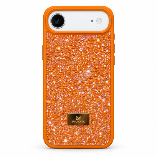 An orange phone case with a glittery orange back, featuring a gold Swarovski logo plaque at the bottom and a white camera cutout.