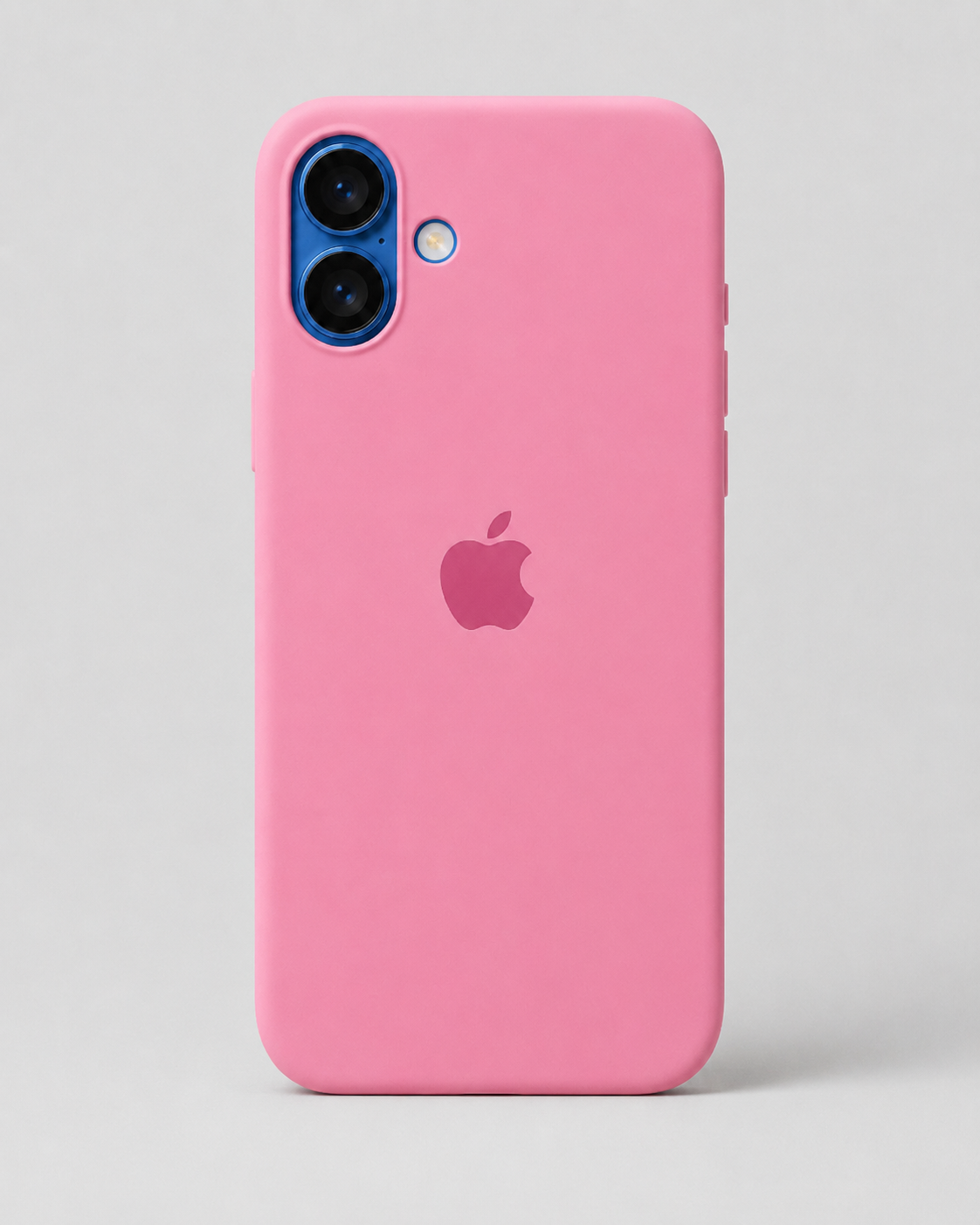 A pink phone case on an iPhone, shown from the back against a light gray background. The Apple logo is visible through the center cutout, and the camera module has a blue ring accent.